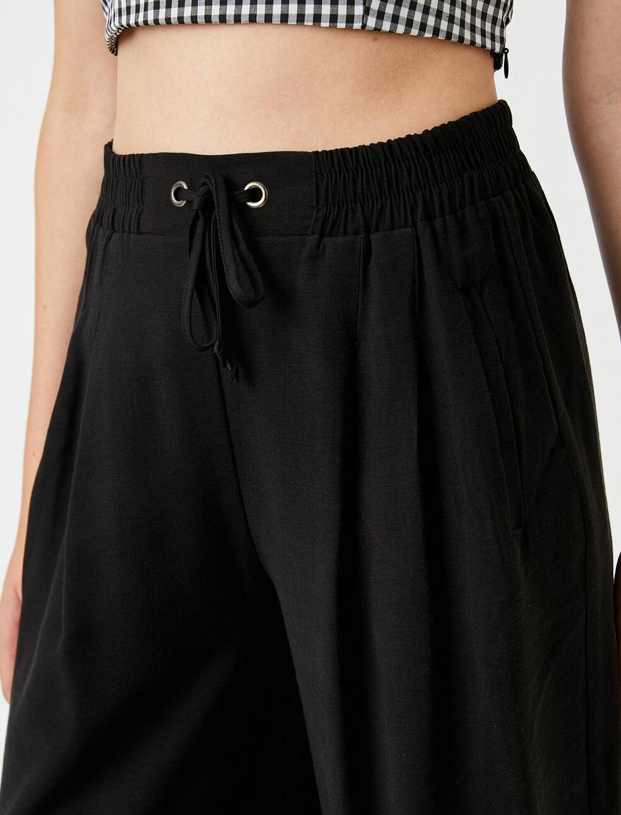   Beli Lastikli Pantolon Pileli Geniş Paça
