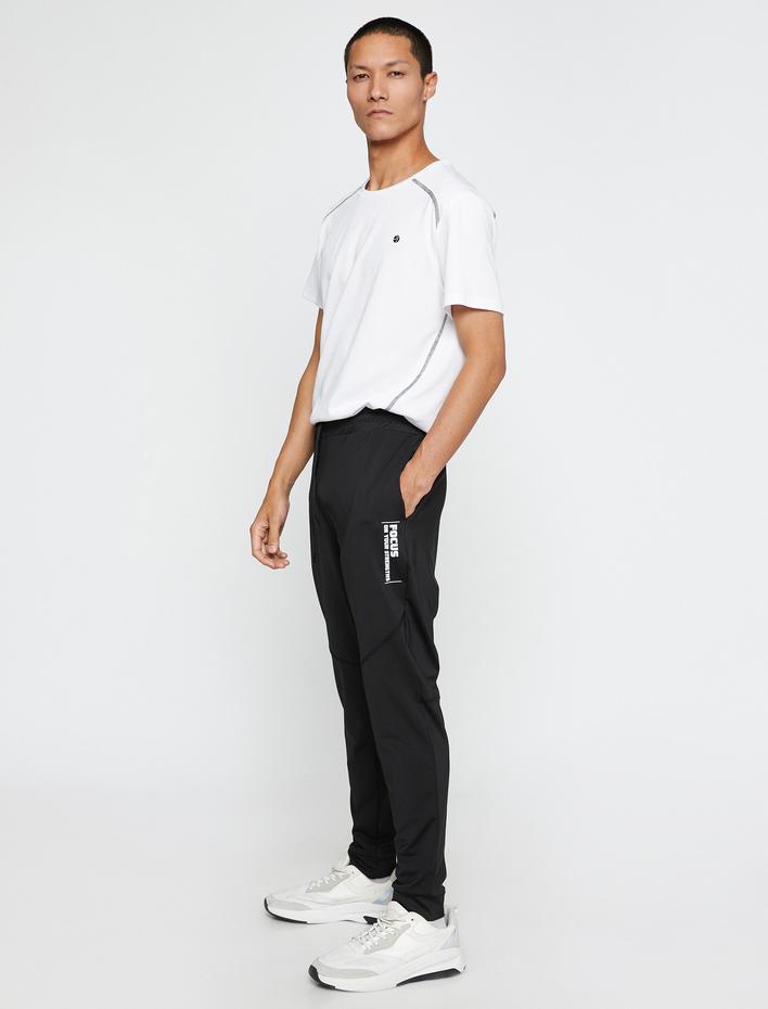  Spor Eşofman Altı Beli Bağcıklı Dikiş Detaylı Slogan Baskılı