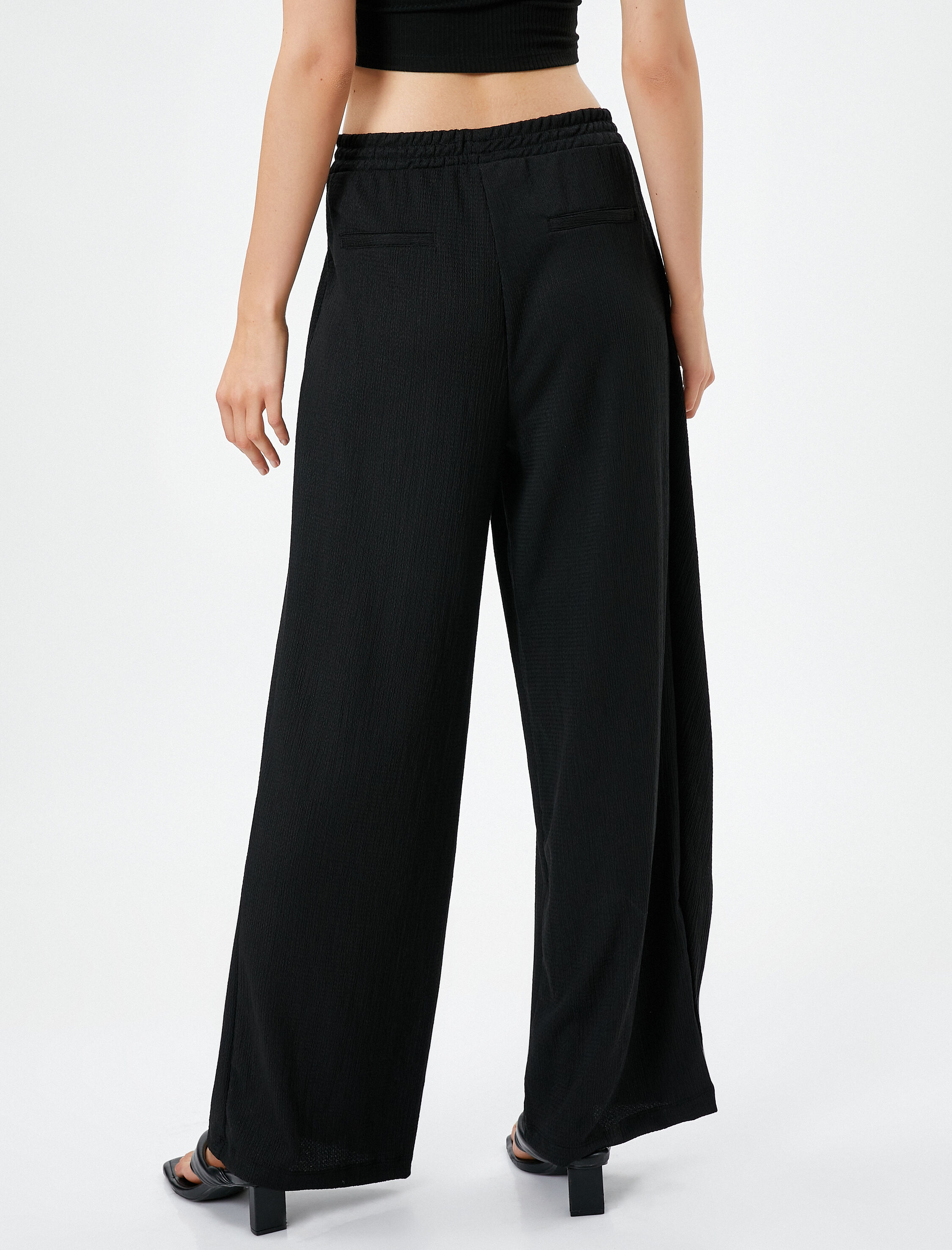   Bol Paça Pantolon Beli Lastikli Asimetrik Kesim Dokulu