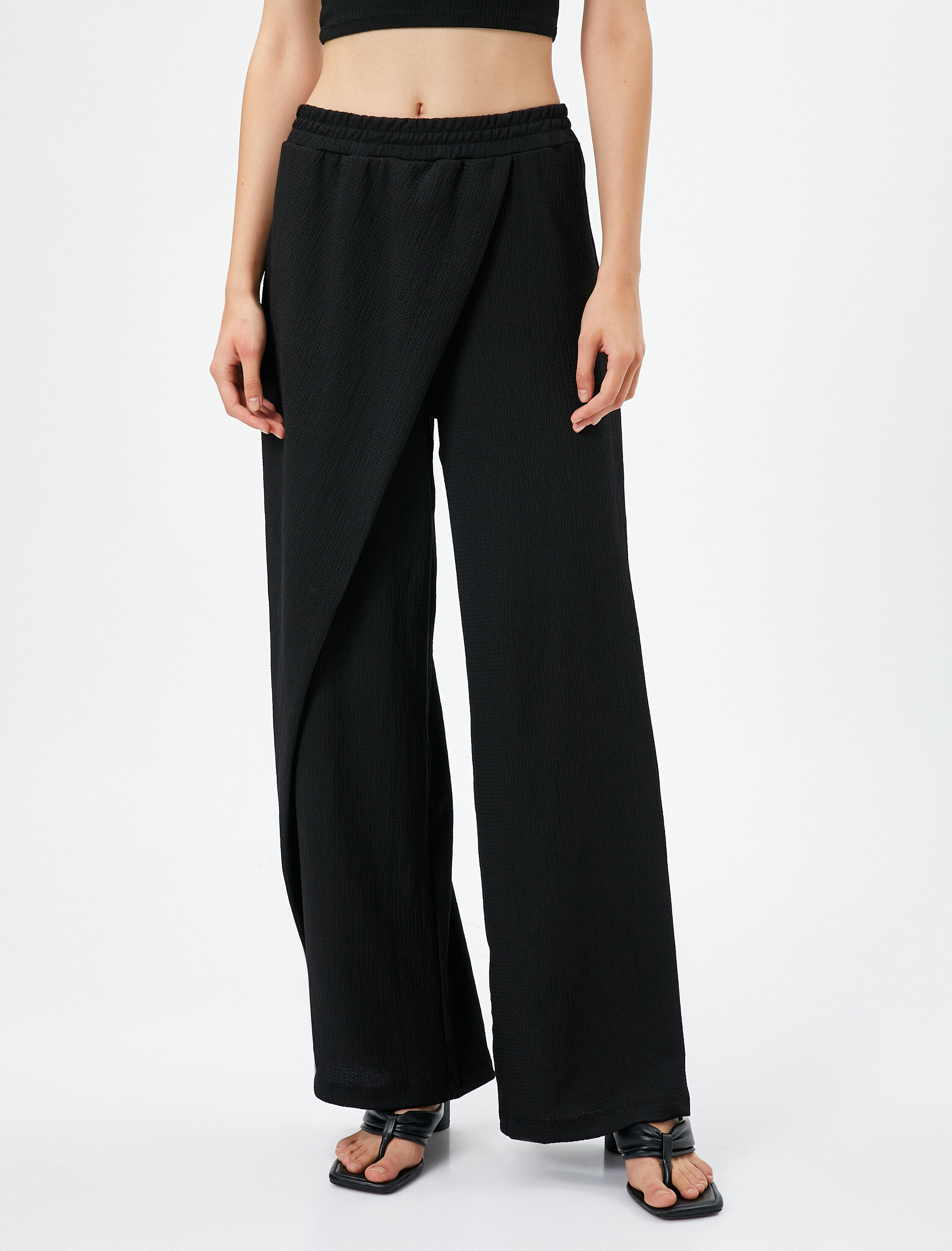   Bol Paça Pantolon Beli Lastikli Asimetrik Kesim Dokulu