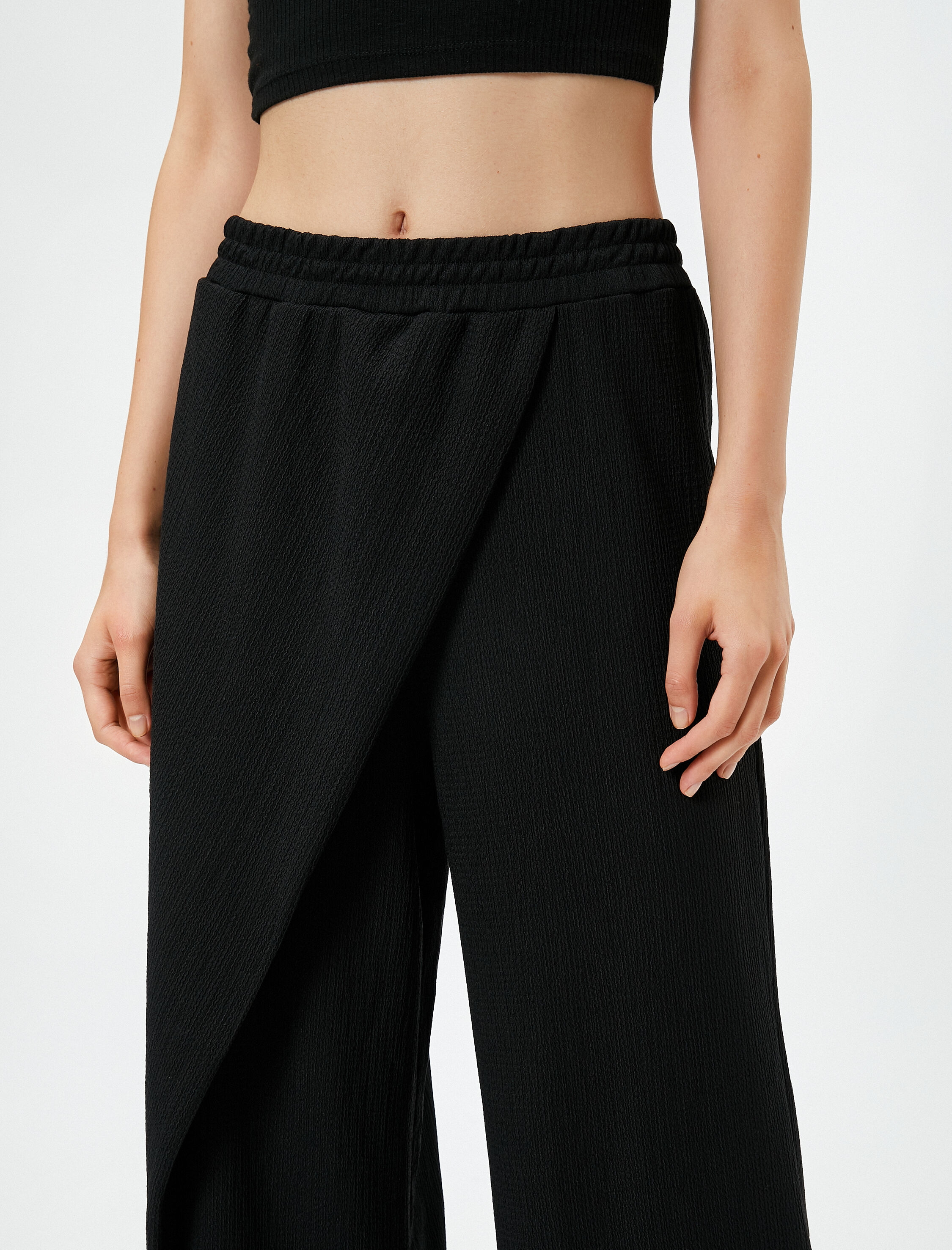   Bol Paça Pantolon Beli Lastikli Asimetrik Kesim Dokulu