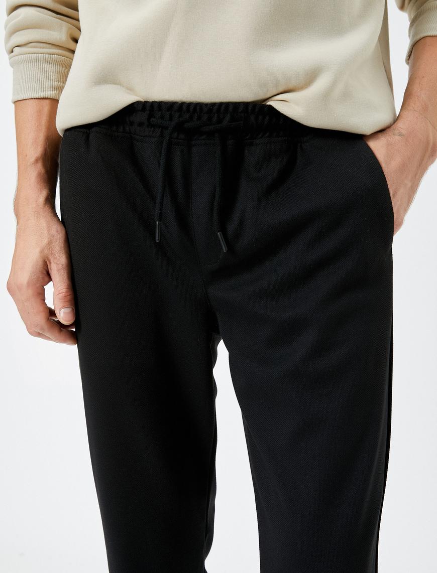   Kumaş Pantolon Beli Bağcıklı Dar Kesim Cep Detaylı