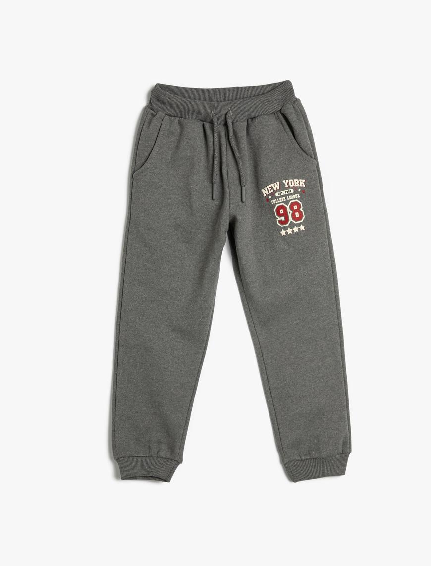  Erkek Çocuk Jogger Eşofman Altı Beli Bağlamalı Cepli Slogan Baskılı Şardonlu