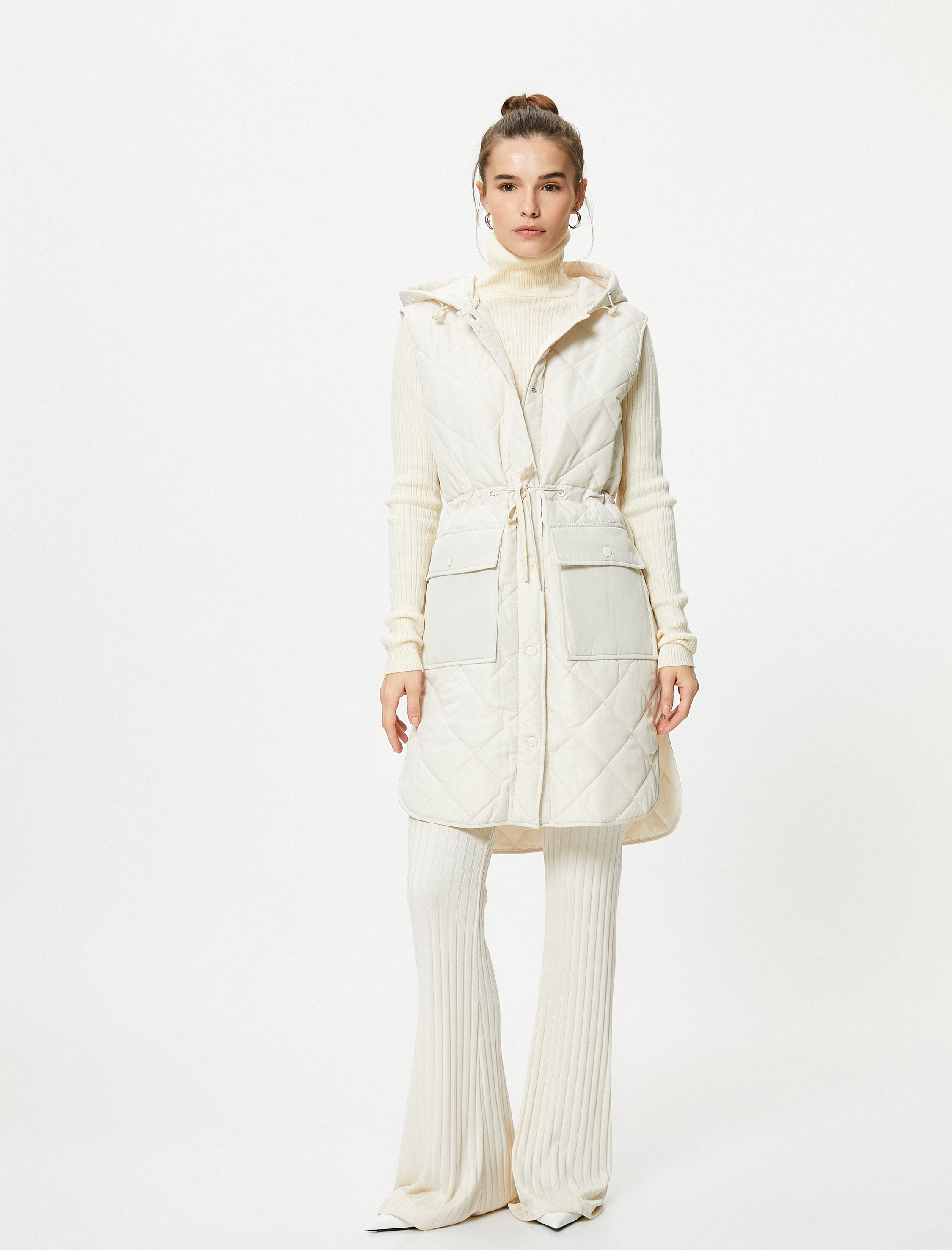   Kapitone Uzun Yelek Cepli Kapüşonlu Beli Bağlamalı Çıtçıt Düğmeli