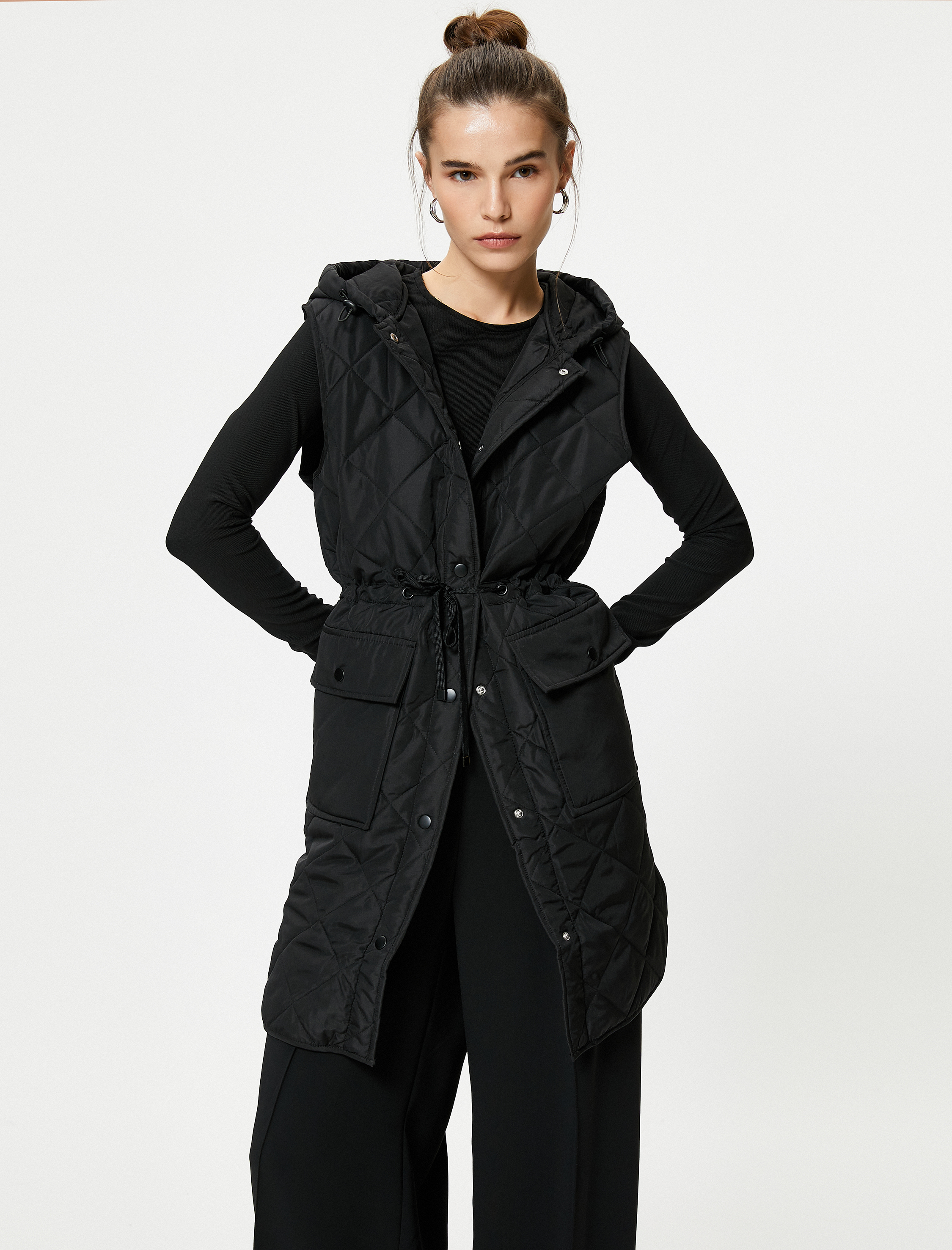   Kapitone Uzun Yelek Cepli Kapüşonlu Beli Bağlamalı Çıtçıt Düğmeli