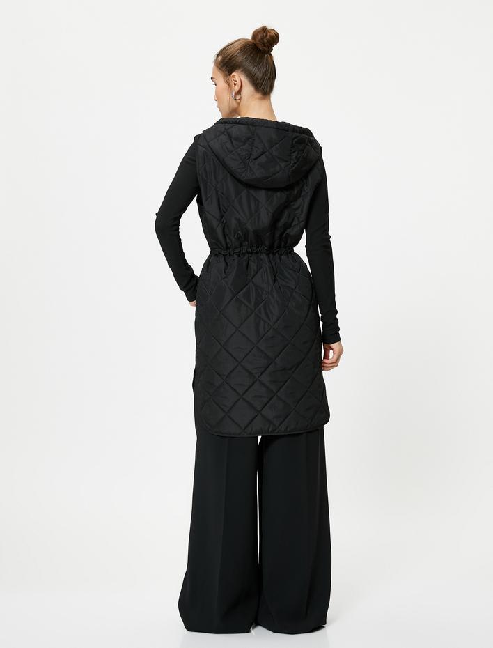  Kapitone Uzun Yelek Cepli Kapüşonlu Beli Bağlamalı Çıtçıt Düğmeli