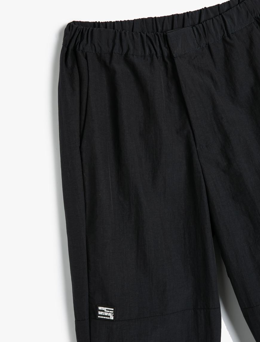   Beli Lastikli Pantolon Dikiş Detaylı Cepli Etiket Baskılı
