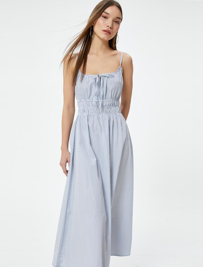  Uzun Askılı Elbise Bağlama Detaylı Gipeli Rahat Kalıp Fiyonk Detaylı