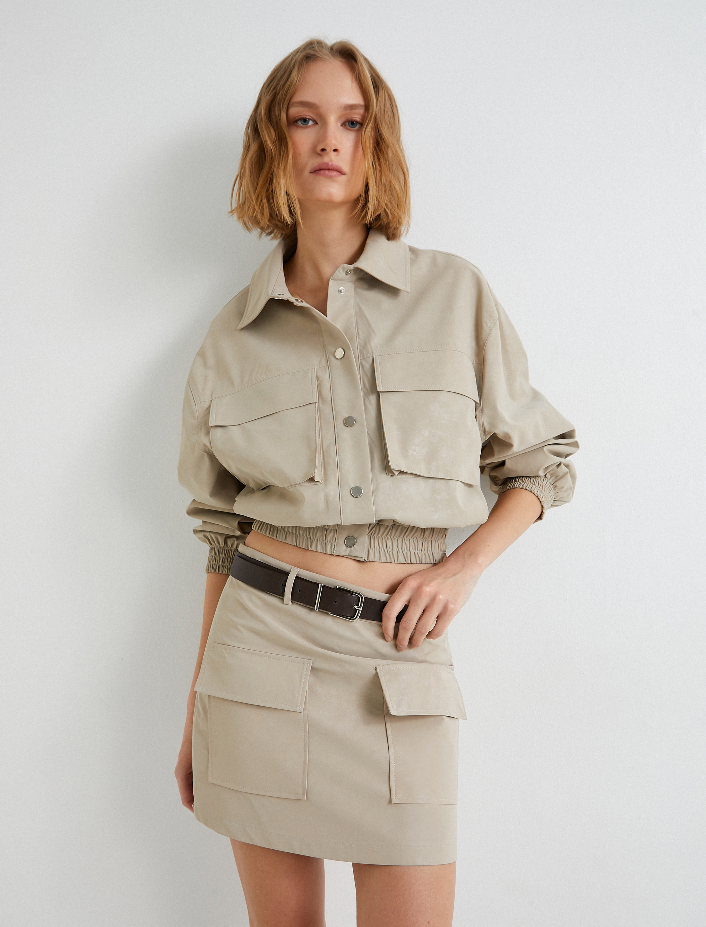   Suni Deri Mini Etek Kapaklı Çift Cep Detaylı A Kesim