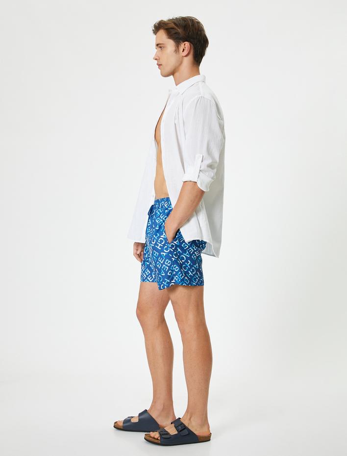  Desenli Kısa Deniz Şortu Cepli Beli Bağlamalı File Astarlı Rahat Kalıp