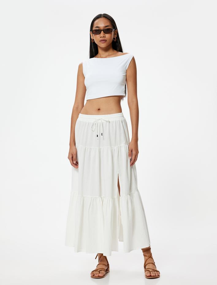  Midi Boy Kloş Etek Yırtmaç Detaylı Katlı Pamuklu