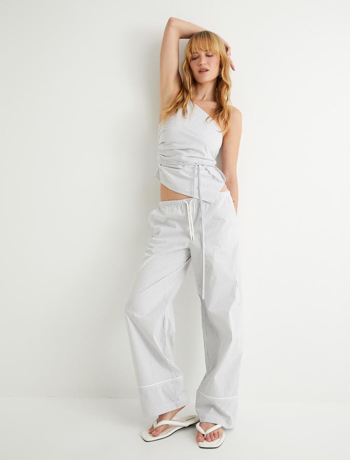  Koton X Sima Tarkan - Asimetrik Tek Omuz Üst Askılı Bağlama Detaylı