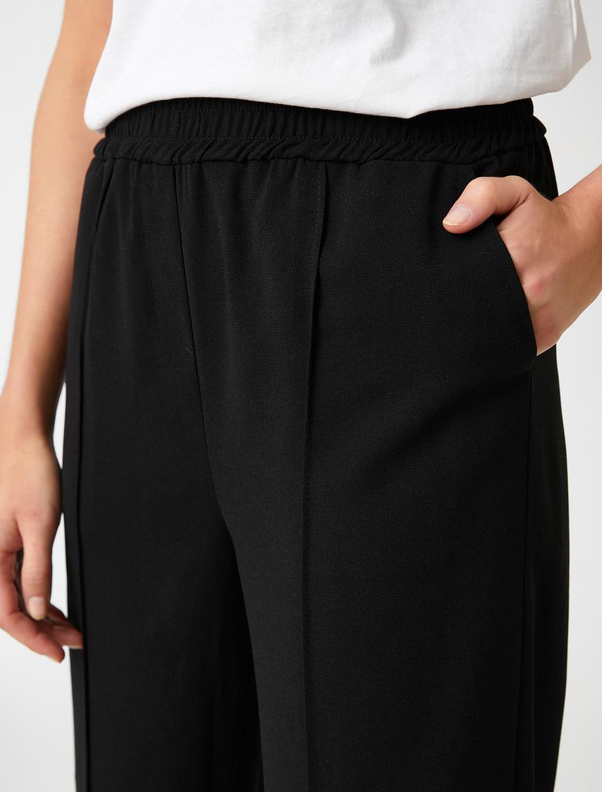   Paçası Yırtmaçlı Bol Paça Pantolon