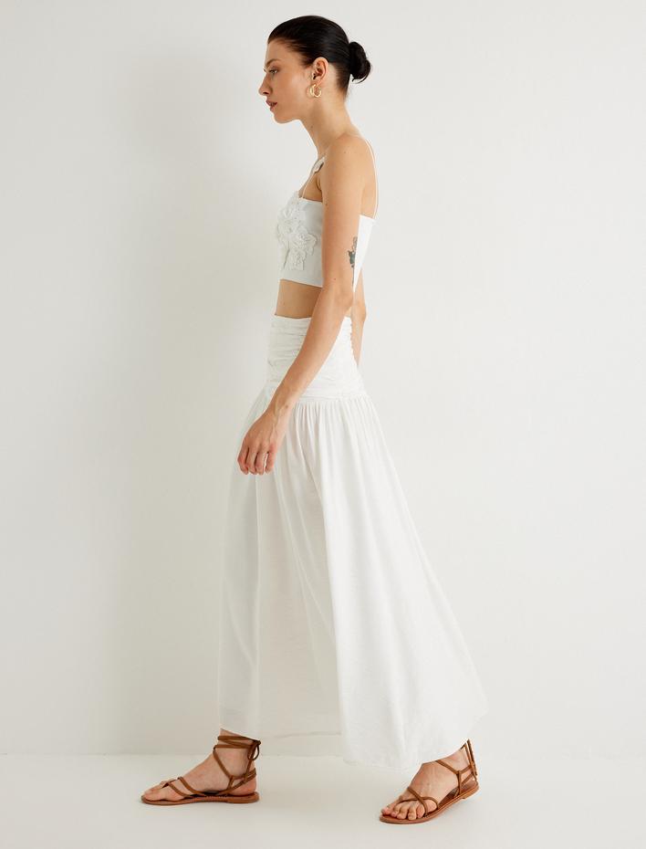  Koton X Melis Ağazat - Midi Boy Kloş Etek Drape Detaylı Viskon Kumaş