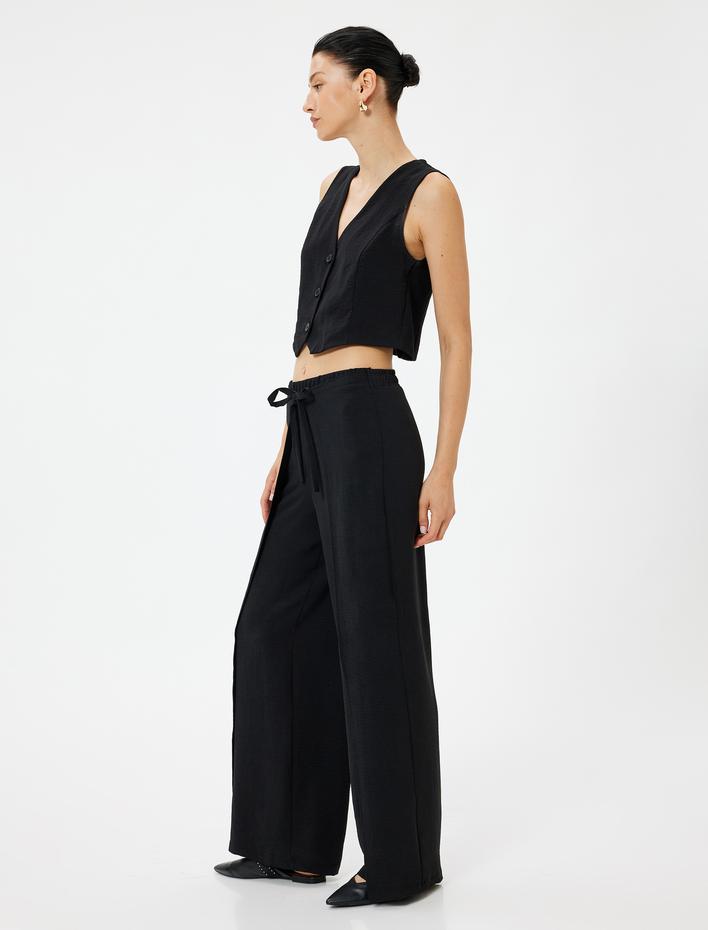  Yandan Kapak Detaylı Bol Paça Pantolon Bağlamalı Aerobin Kumaş