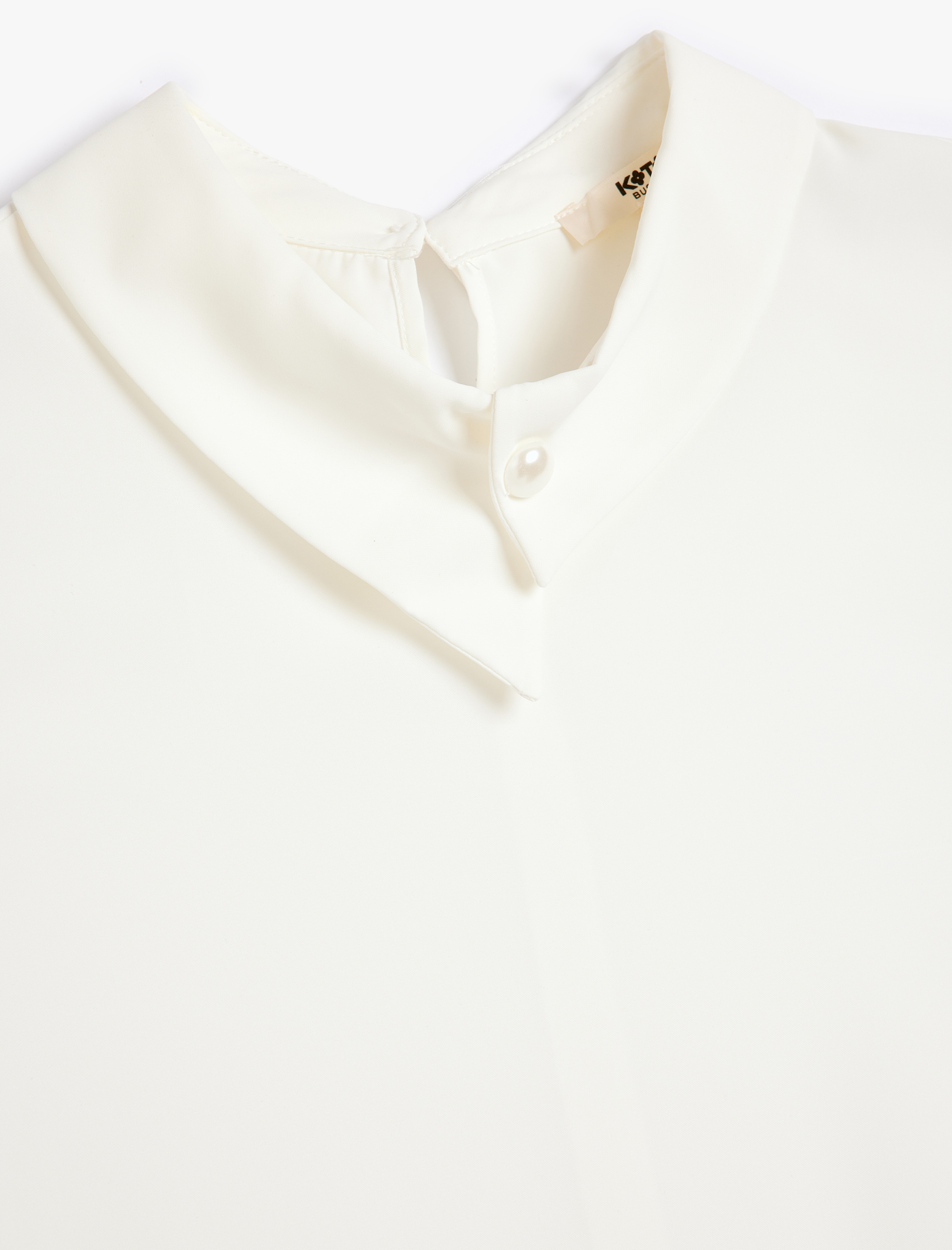   Asimetrik Gömlek Yaka Düğme Detaylı Kolsuz Bluz