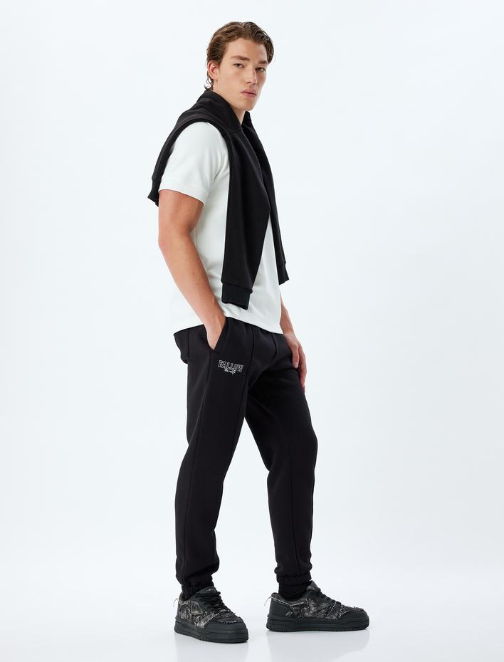  Spor Eşofman Altı Jogger Slogan Baskılı Cep Detaylı Şardonlu Pamuk Karışımlı