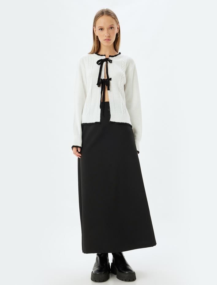  Triko Fiyonk Bağlama Detaylı Dokulu Hırka