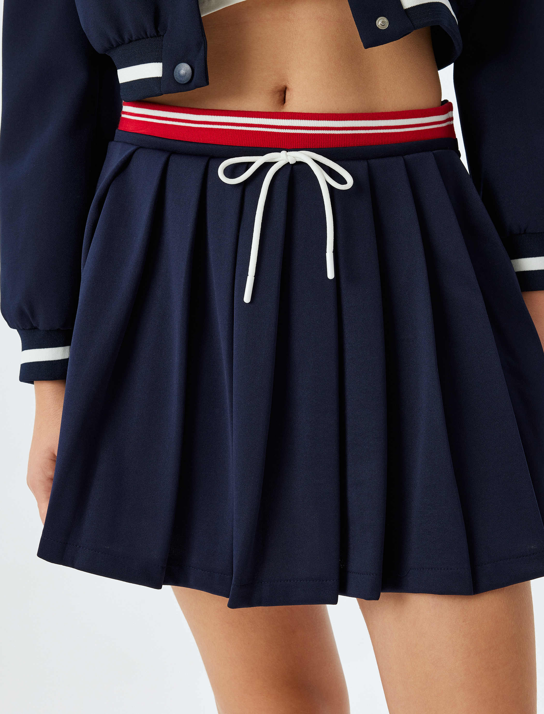   Mini Pileli Bağcıklı Biyeli Yüksek Bel Rahat Kalıp Etek