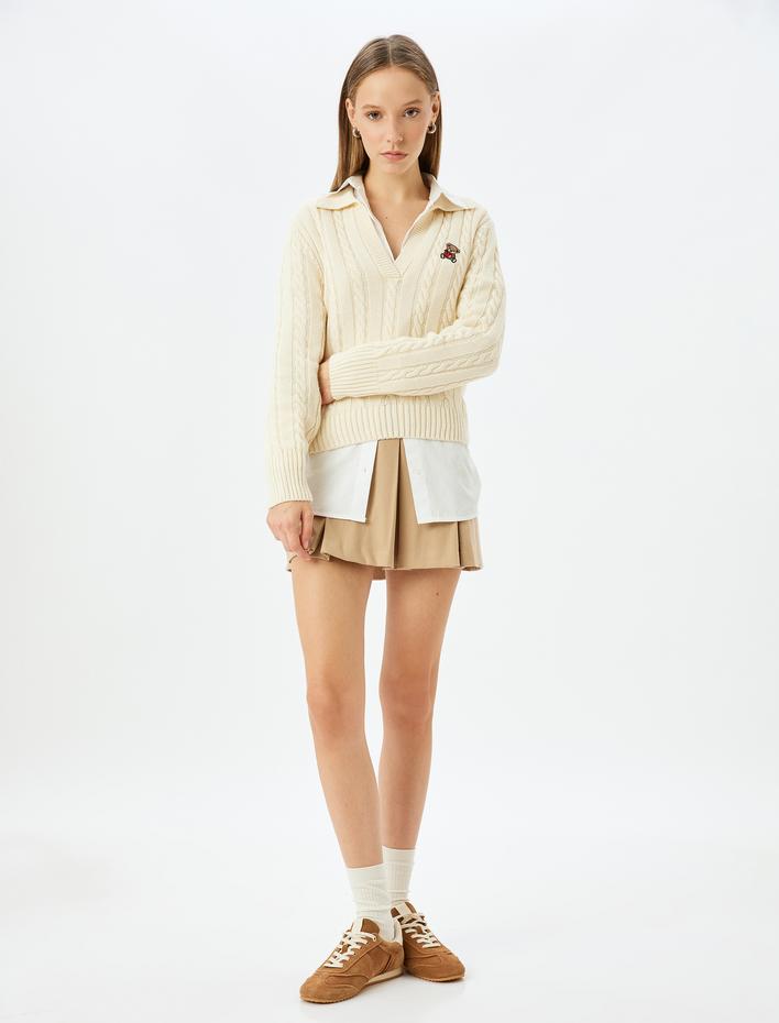  Polo Yaka Ayı İşlemeli Saç Örgü Dokulu Kazak