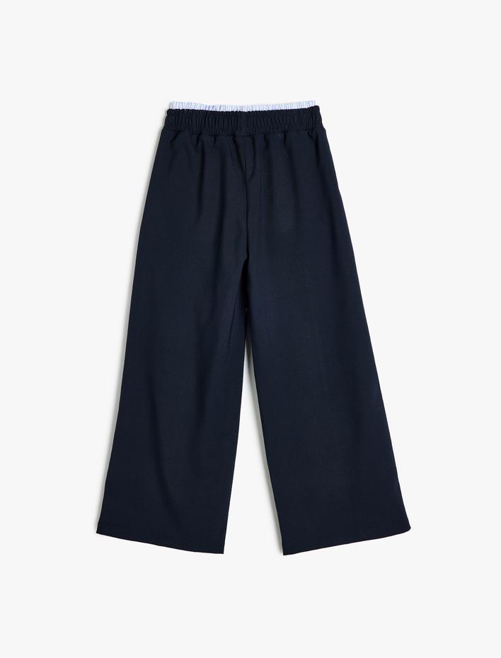 Kız Çocuk Cep Detaylı Beli Lastikli Viskon Karışımlı Bol Paça Pantolon