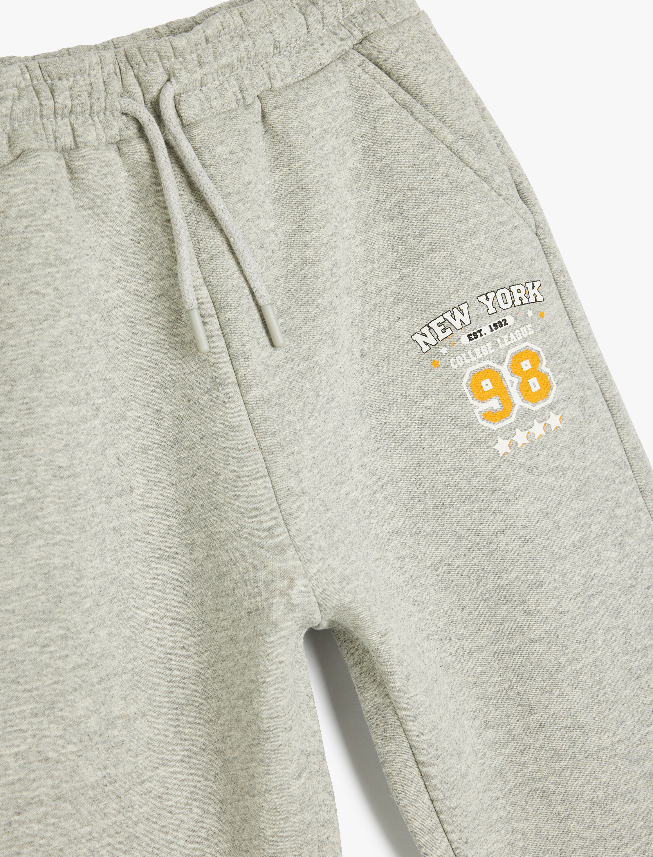  Erkek Çocuk Cep Detaylı Beli Bağlamalı Baskılı Şardonlu Jogger Eşofman Altı