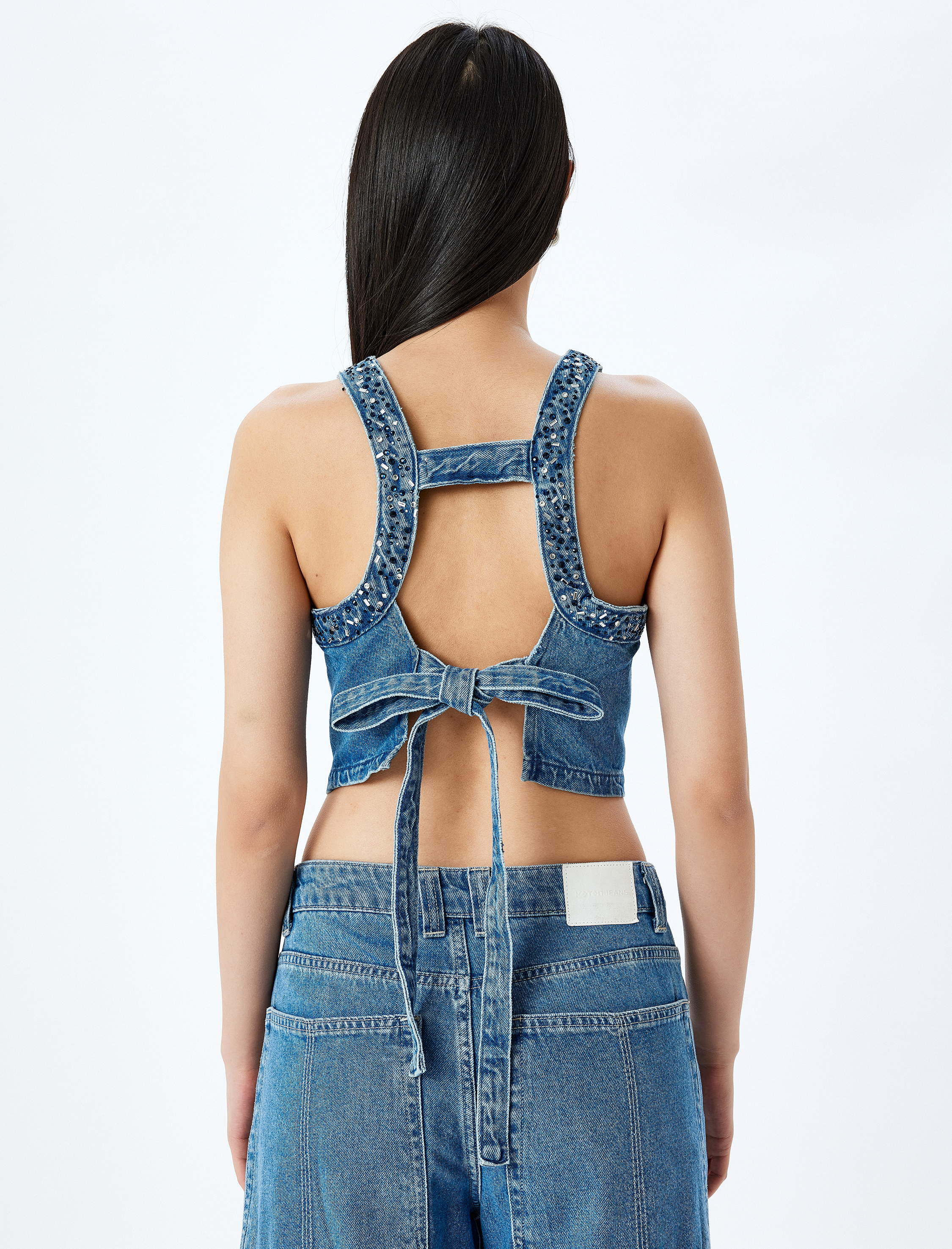   Taş Detaylı Sırtı Bağcıklı Crop Kolsuz Denim Bluz
