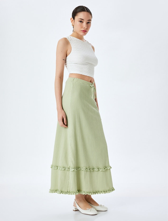  Yüksek Bel Fırfır Detaylı Fiyonklu Midi Etek Bürümcük