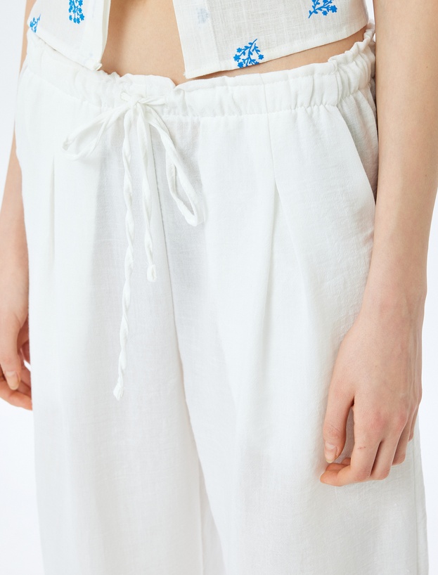 Beli Bağcıklı Cepli Düz Paça Pileli Pantolon_4