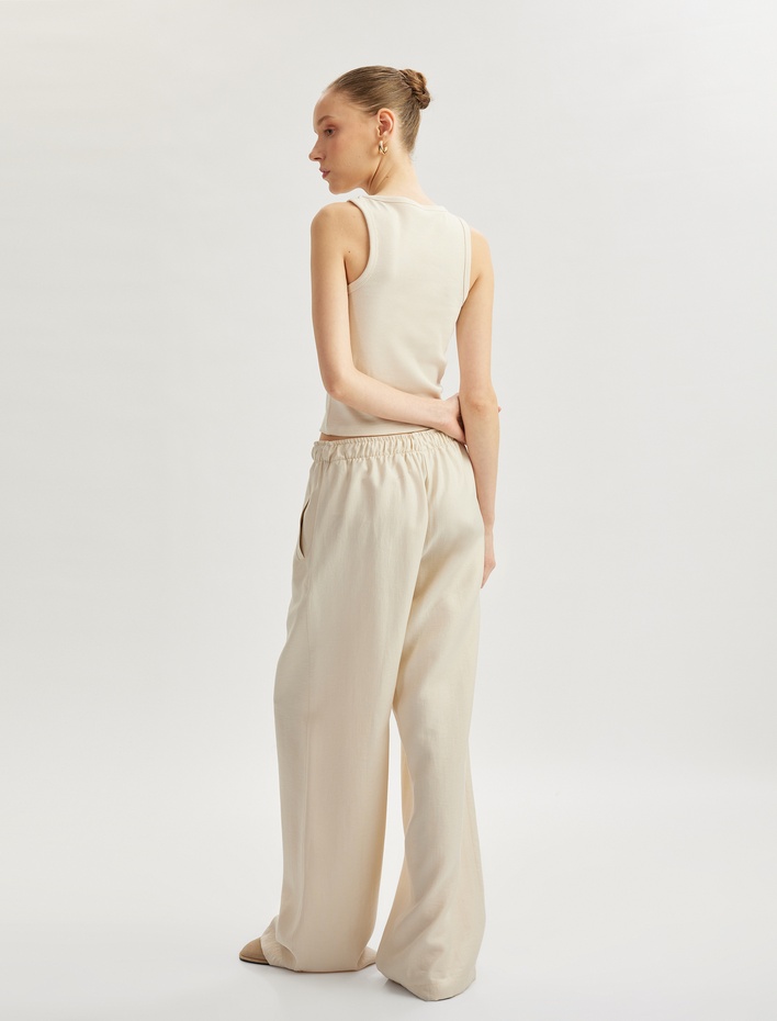  Beli Bağcıklı Cep Detaylı Geniş Paça Pantolon