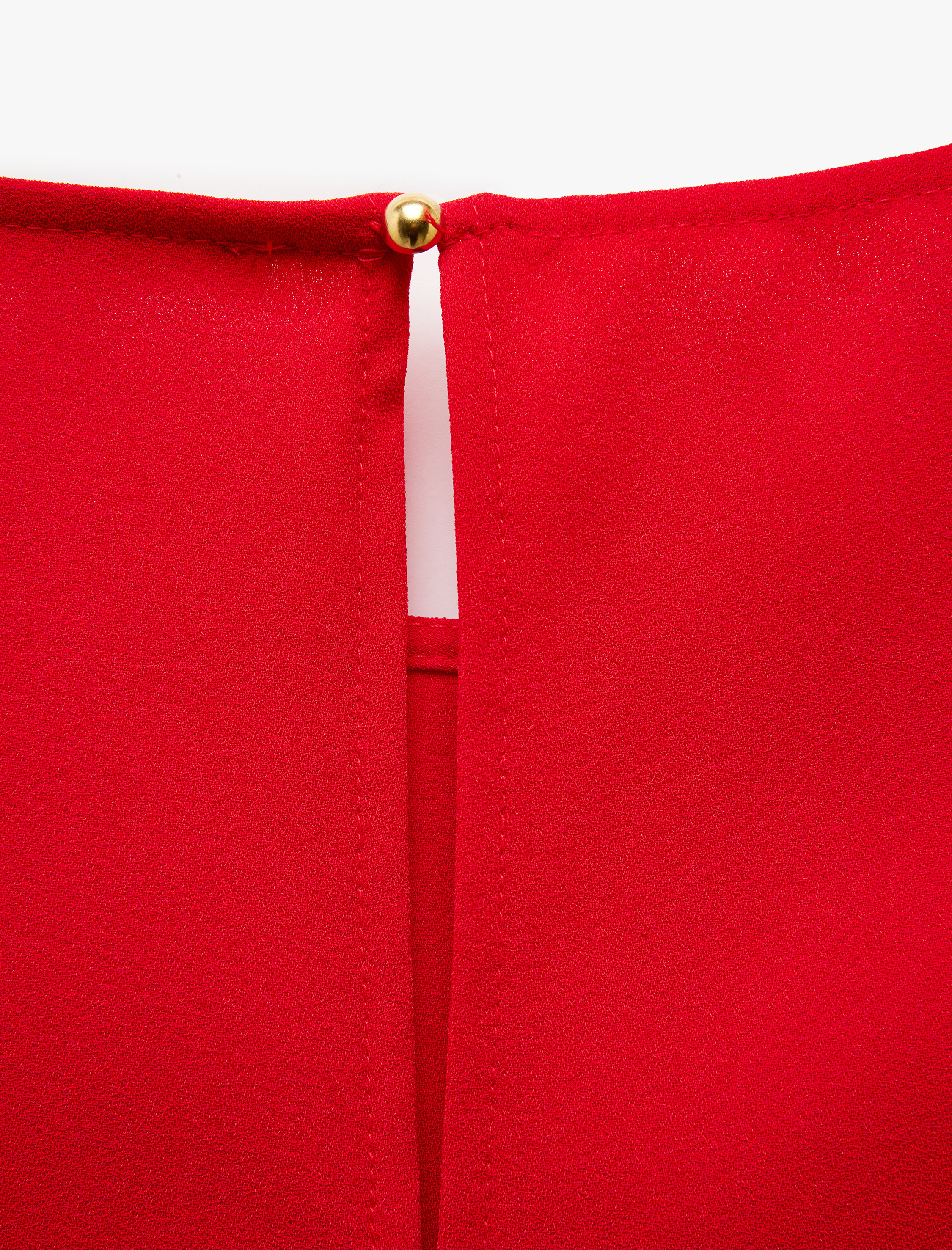   Metal Aksesuar Detaylı Yuvarlak Yaka Kolsuz Bluz