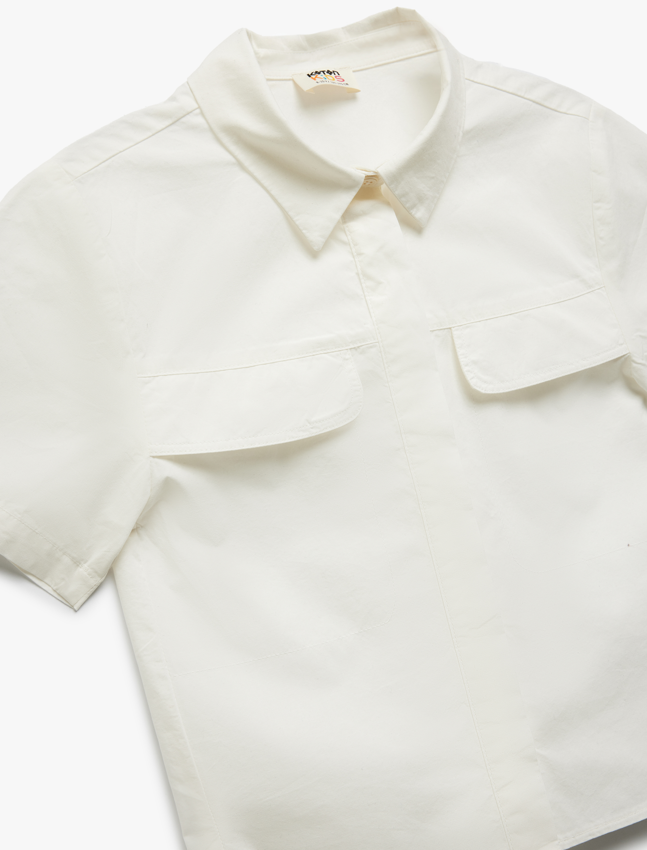  Kız Çocuk Pamuklu Kısa Kollu Cep Detaylı Oversize Gömlek