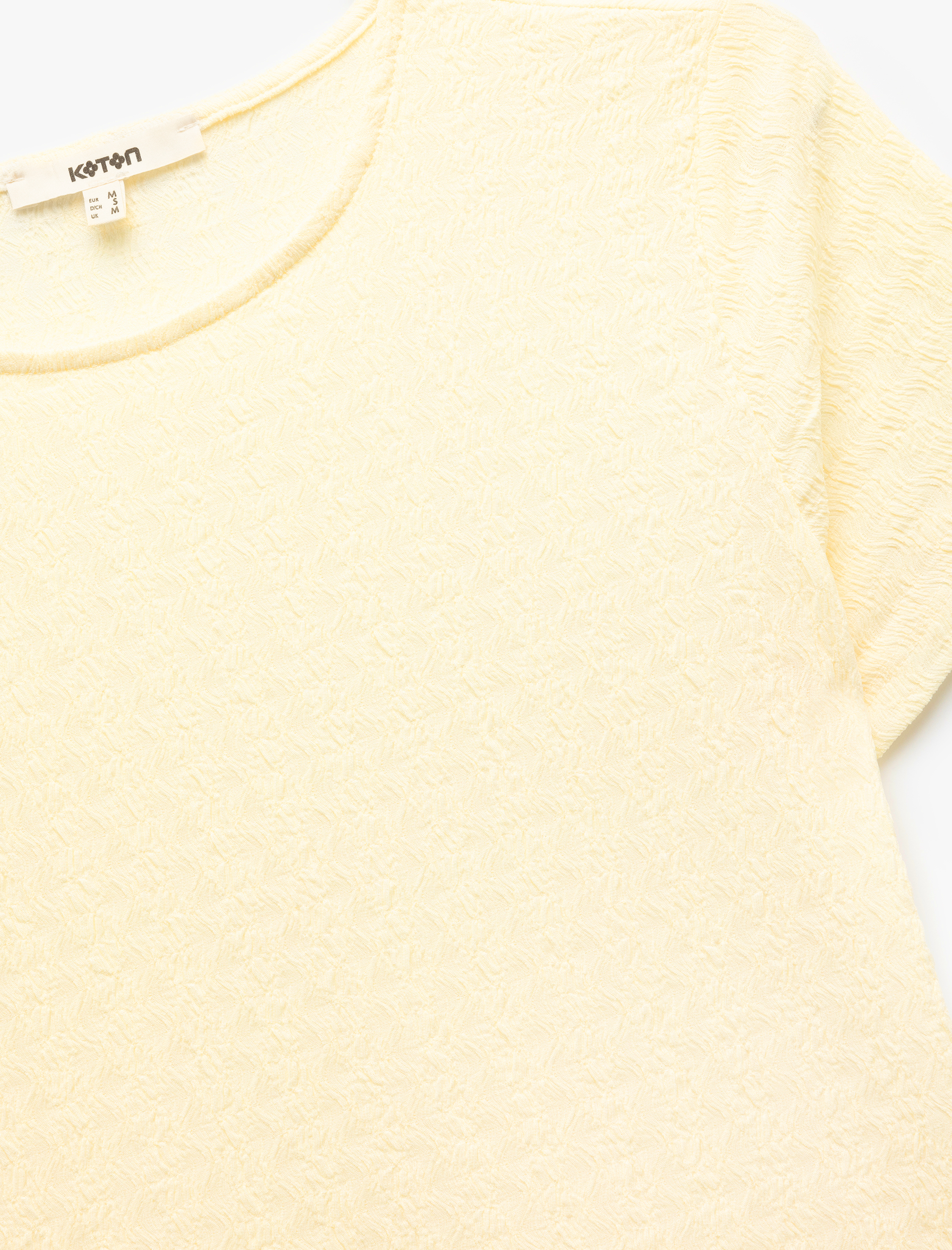   Bürümcük Kumaş Dokulu Kısa Kollu Bisiklet Yaka Peplum Tişört