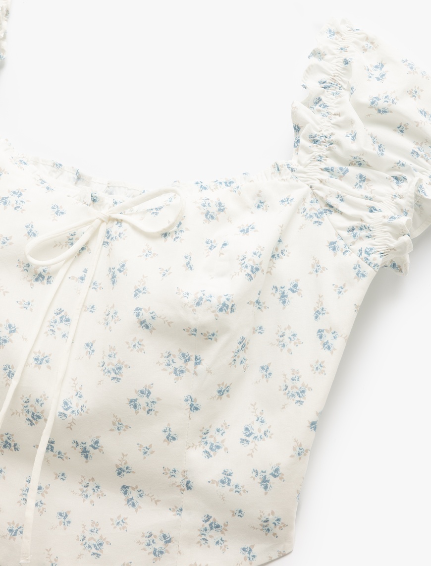   Kayık Yaka Bağcık Detaylı Fermuarlı Çiçekli Dar Kesim Poplin Crop Bluz
