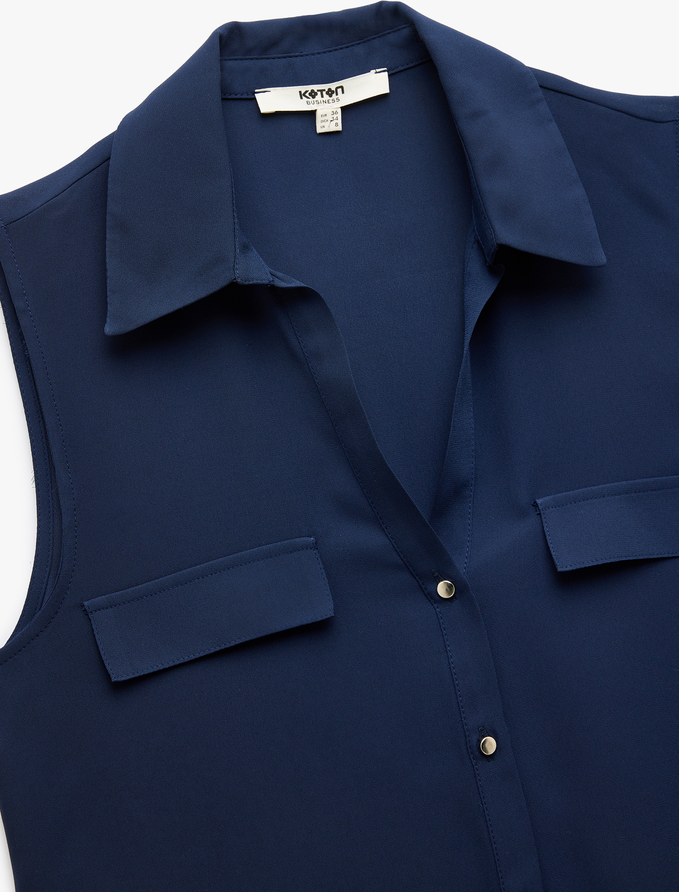   Düğmeli Aplike Detaylı Klasik Yaka Kolsuz Keten Karışımlı Gömlek