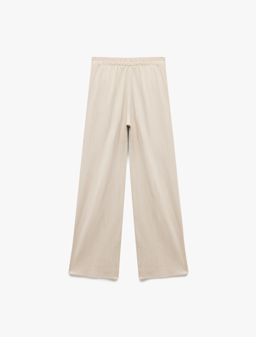   Regular Fit Cepli Pile Detaylı Geniş Paça Kumaş Pantolon