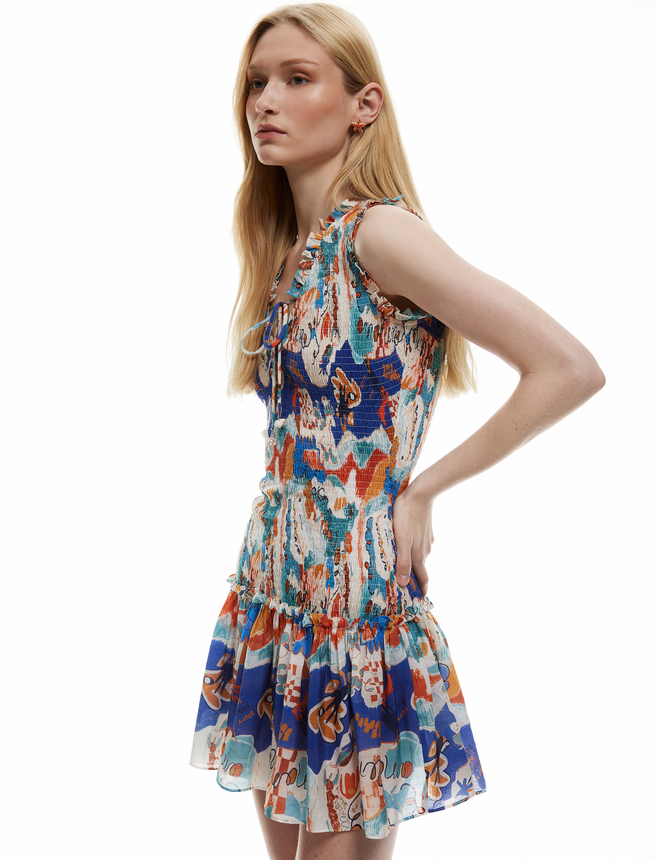   Koton X Şahika Ercümen - Etnik Desenli Bağlamalı Yaka Kolsuz Gipeli Fırfırlı Mini Elbise