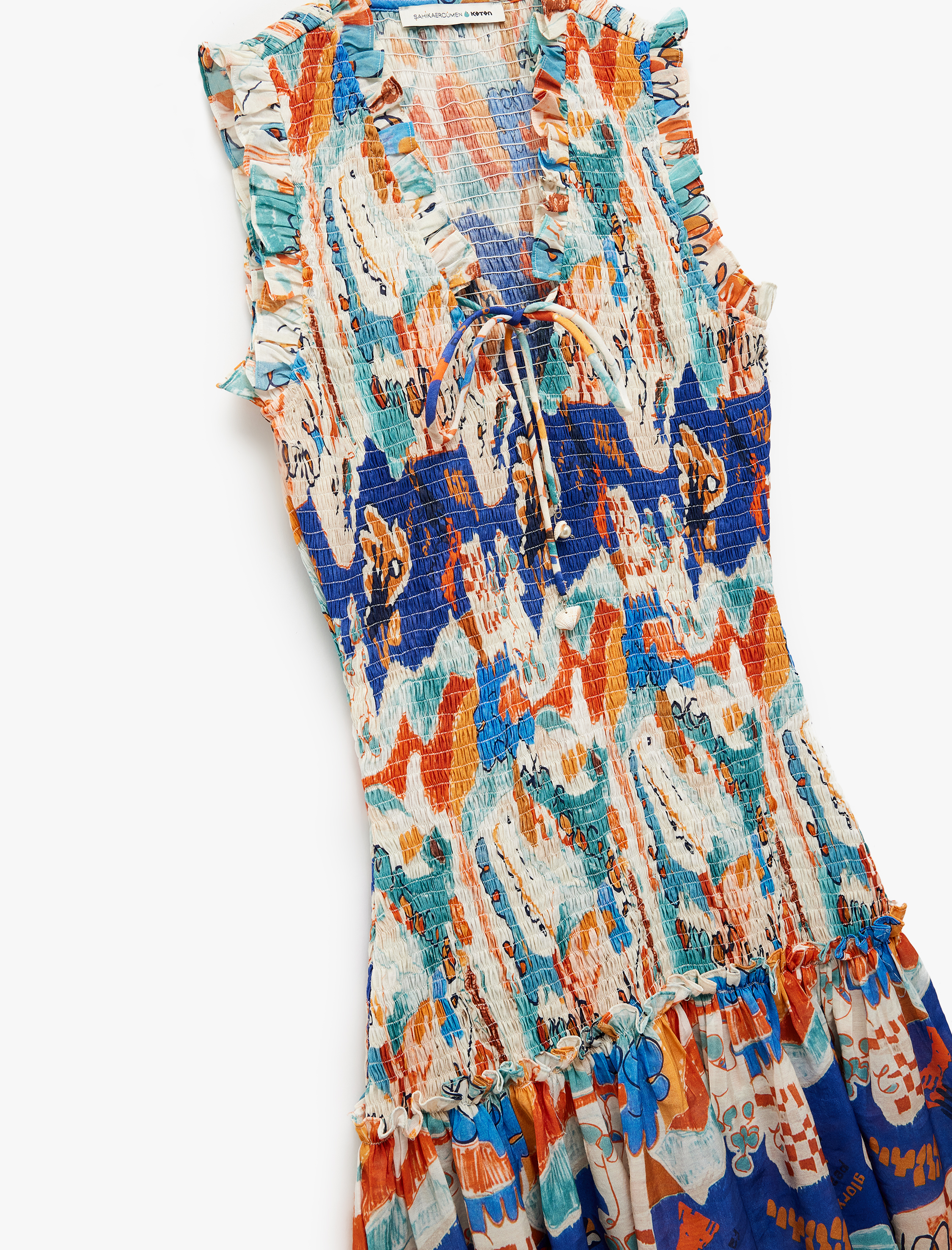   Koton X Şahika Ercümen - Etnik Desenli Bağlamalı Yaka Kolsuz Gipeli Fırfırlı Mini Elbise