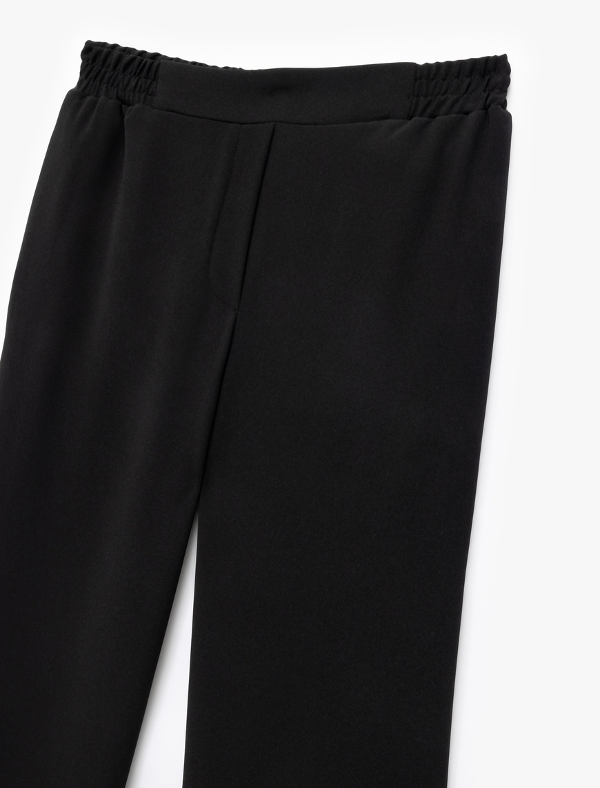   Krep Kumaş Beli Lastikli Düz Bol Paça Pantolon