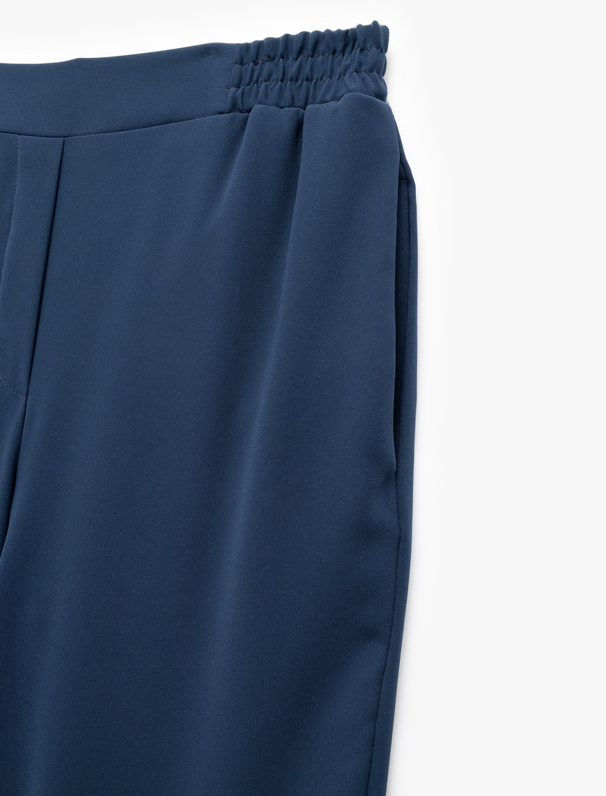   Krep Kumaş Beli Lastikli Düz Bol Paça Pantolon