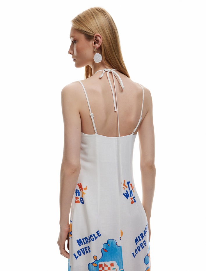  Koton X Şahika Ercümen - Kolsuz Boyundan Bağlama Detaylı Yırtmaçlı Desenli İnce Askılı Midi Elbise