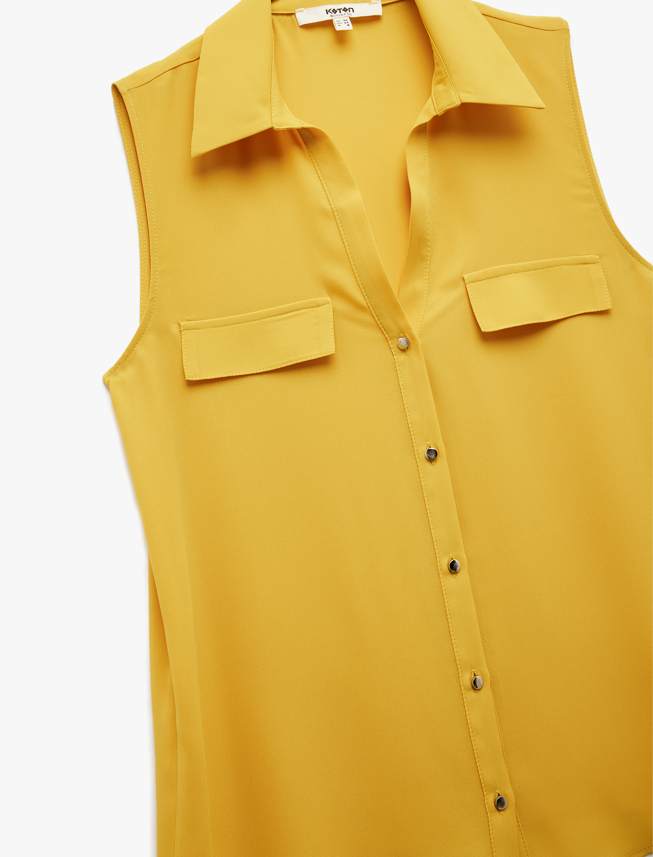   Düğmeli Aplike Detaylı Klasik Yaka Kolsuz Keten Karışımlı Gömlek