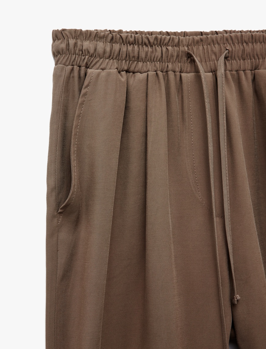   Viskon Cupro Kumaş Beli Bağcıklı Cepli Bol Paça Pantolon