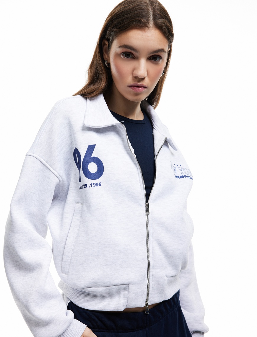   Şardonlu Uzun Kollu Cepli Arkası Baskılı Fermuarlı Sweatshirt