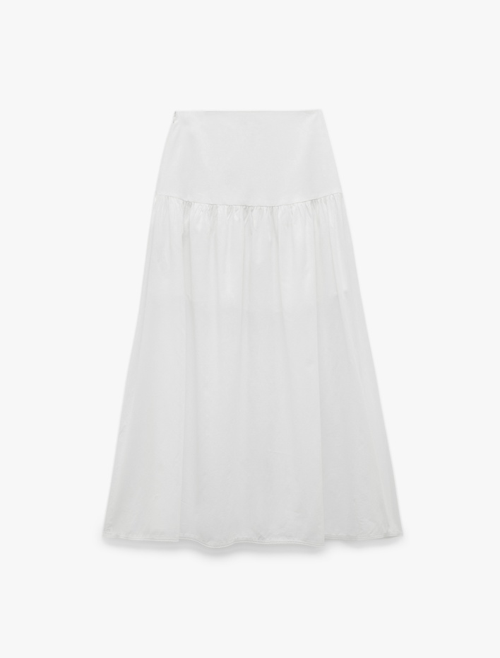  Koton X Sibil Çetinkaya - Pamuklu Bağlama Detaylı Fiyonklu Çan Kesim Midi Kloş Etek