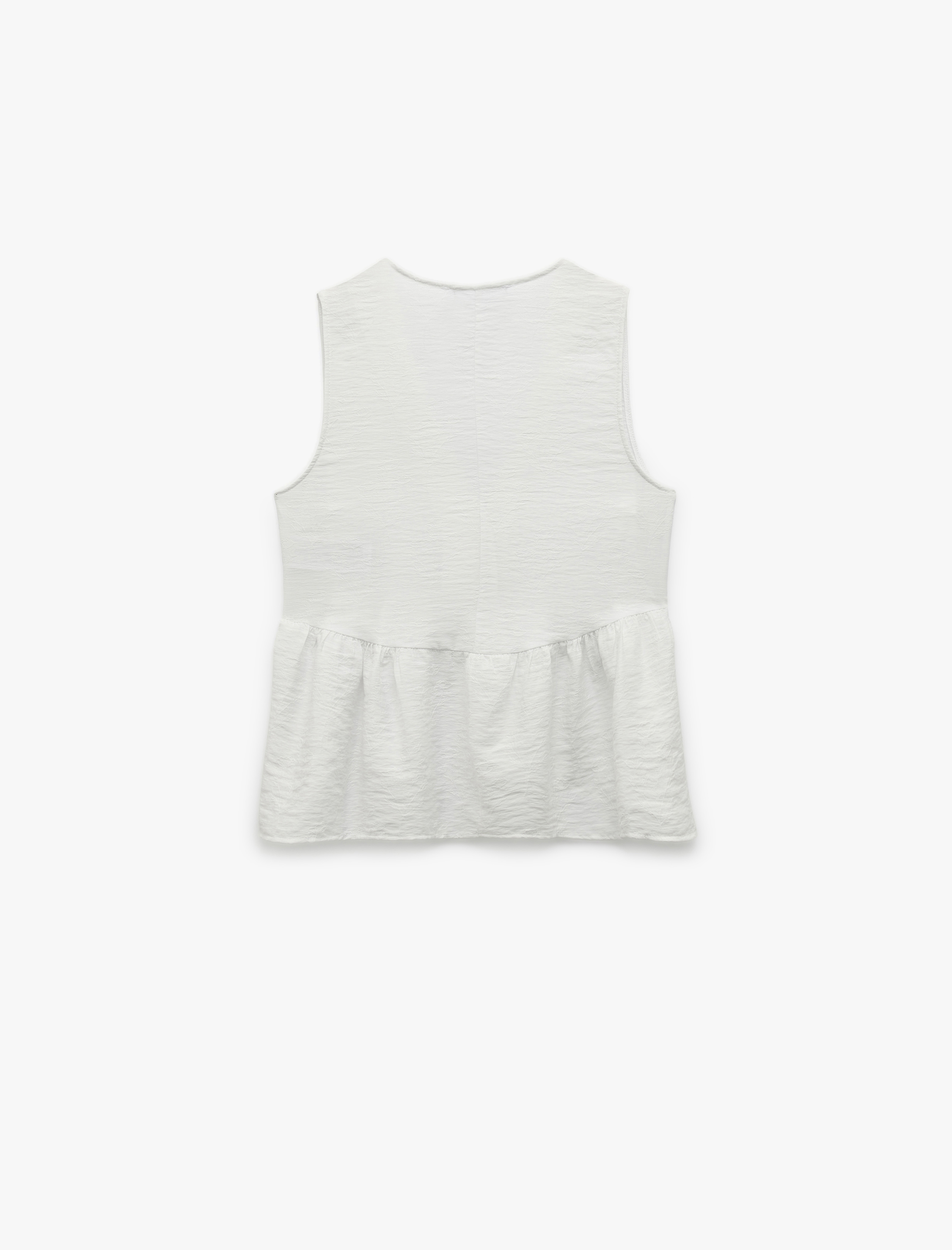 Koton X Melis Ağazat - Deniz Kabuğu Aksesuar Detaylı V Yaka Kolsuz Peplum Bluz