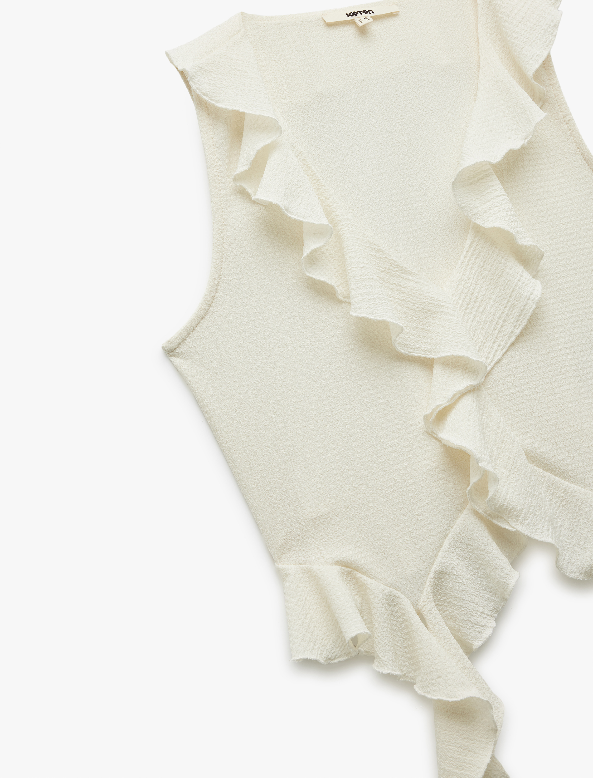   Bürümcük Kumaş Dokulu V Yaka Kolsuz Asimetrik Fırfırlı Bluz