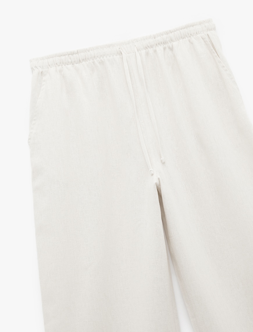   Regular Fit Cepli Pile Detaylı Geniş Paça Kumaş Pantolon