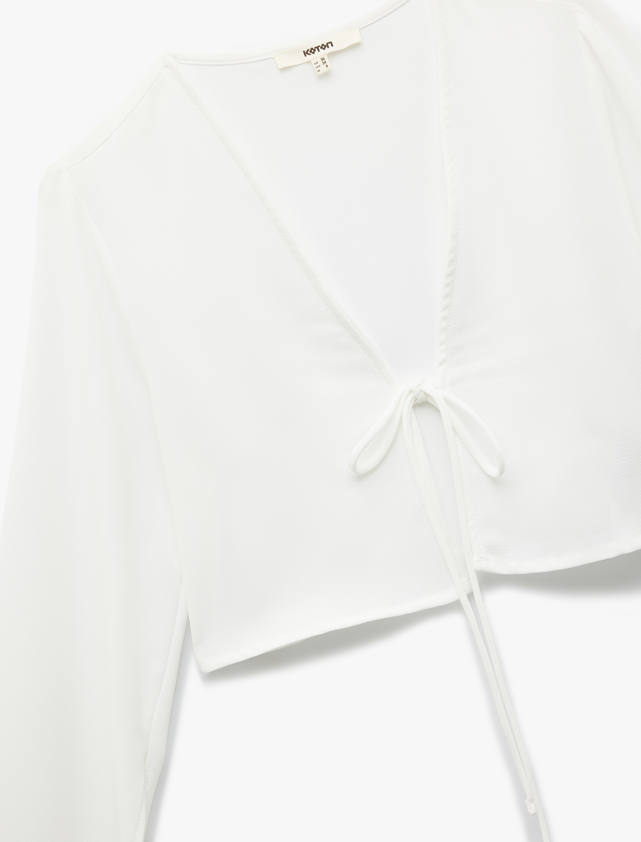   V Yaka Uzun Çan Kol Önden Bağlamalı Fiyonk Detaylı Crop Bluz