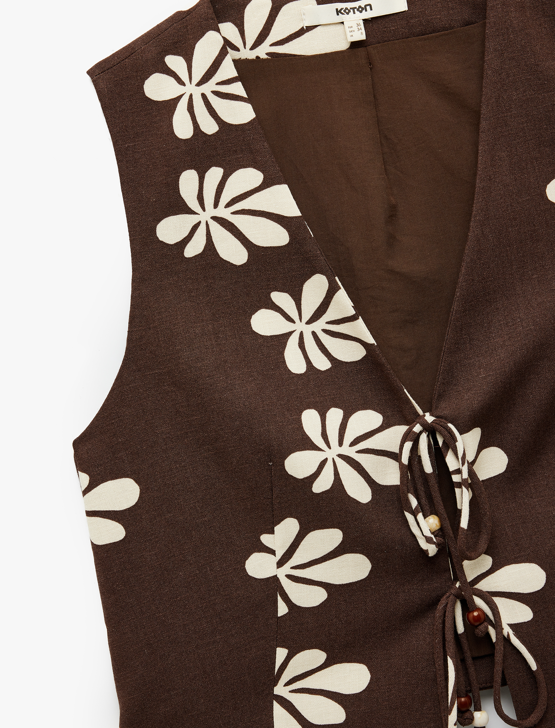   Astarlı Keten Karışımlı Bağlama Detaylı Fiyonklu V Yaka Çiçekli Crop Yelek